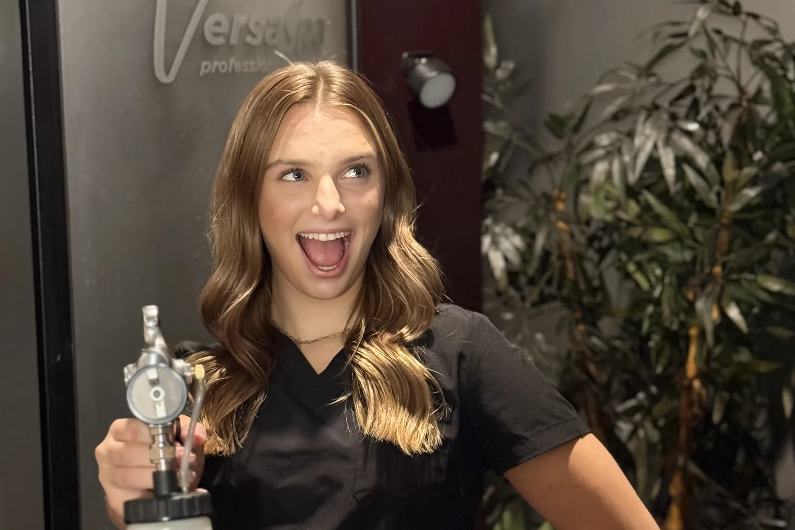 Airbrush spray tan station with VersaSpa booth at Renewed Med Spa and Tanning, Glendale AZ