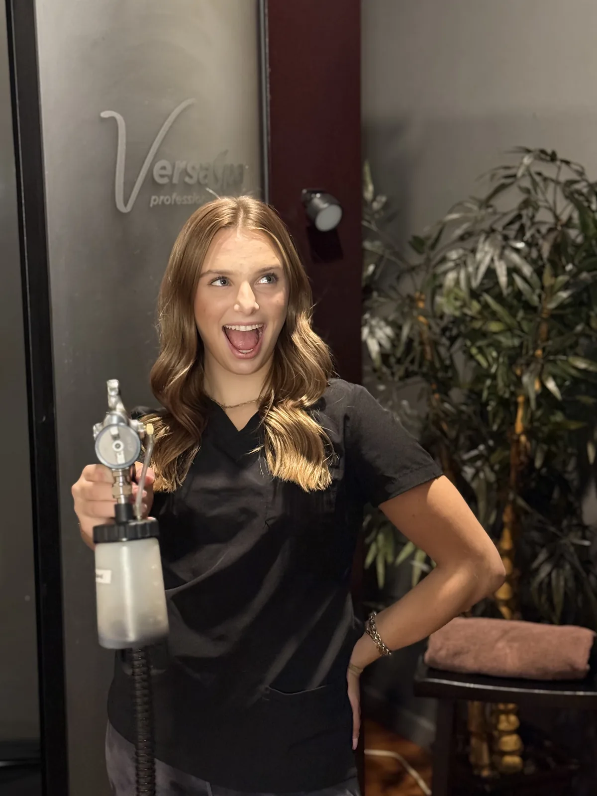 Airbrush spray tan station with VersaSpa booth at Renewed Med Spa and Tanning, Glendale AZ