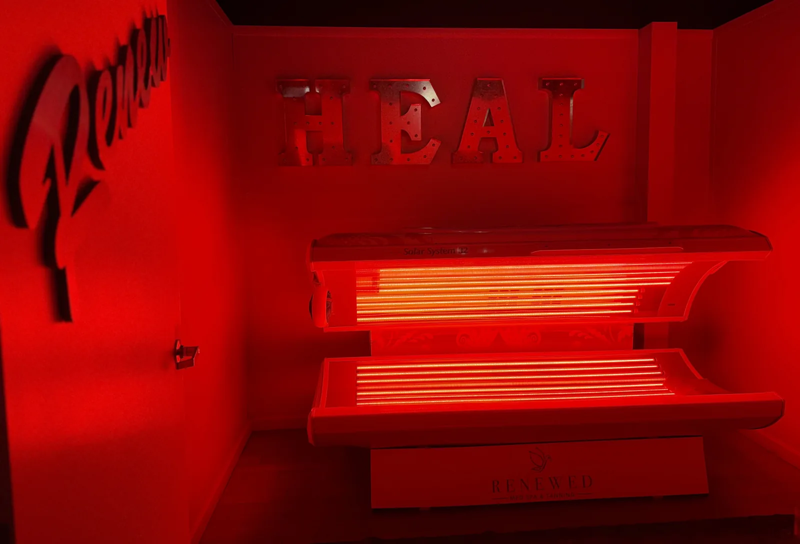 Red light therapy bed in the HEAL room at Renewed Med Spa and Tanning, Glendale AZ
